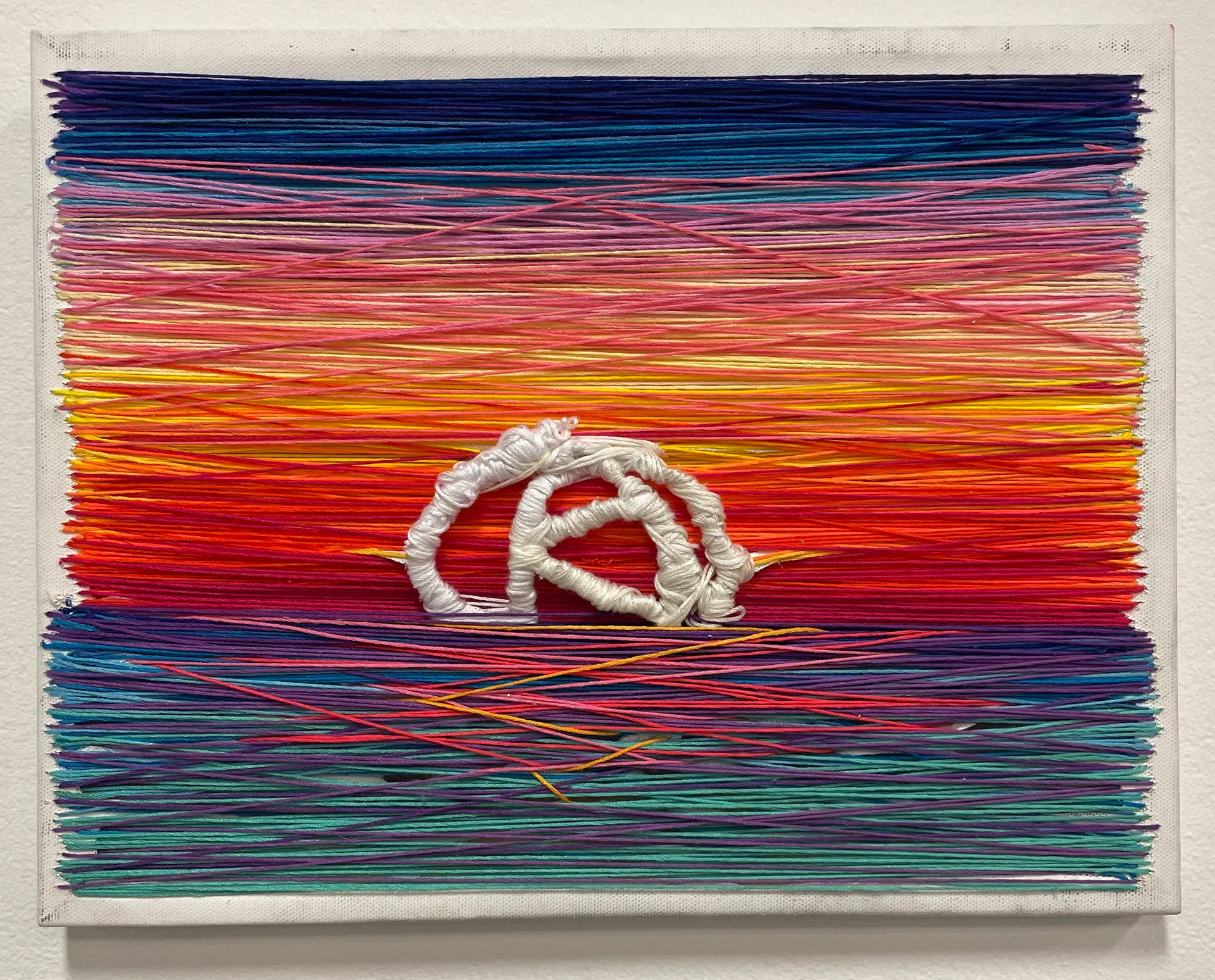 Embroidered canvas in sunset colors expressing emotion through color